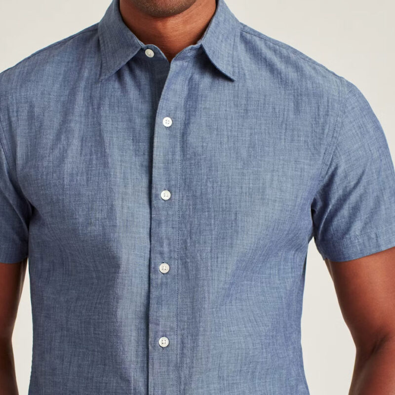 Male model wearing Bonobos short sleeve chambray shirt.