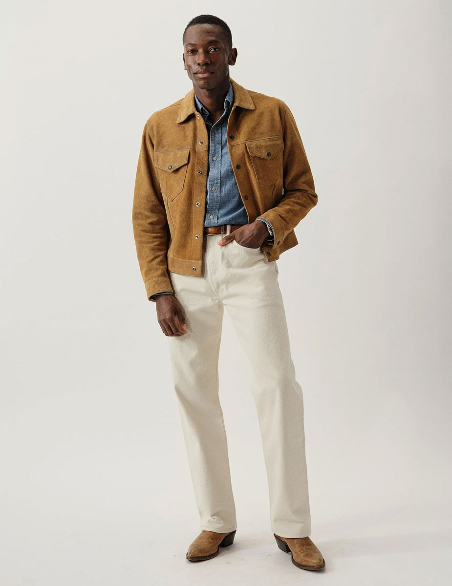 Full cowboy inspired outfit with Buck Mason's Rambler Suede Jacket including chambray shirt and cowboy boots.
