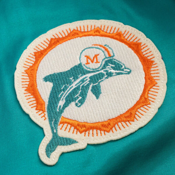 Close-up view of logo patch on Miami Dolphins windbreaker