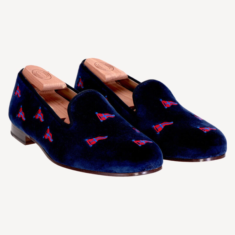 Three-quarter front view of Stubbs & Wootton Yacht Club Navy Slippers.