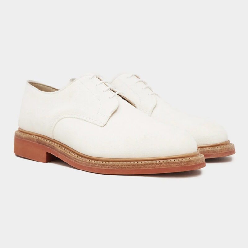 Three-quarter view of Todd Snyder x Sanders White Suede Buck dress shoes.