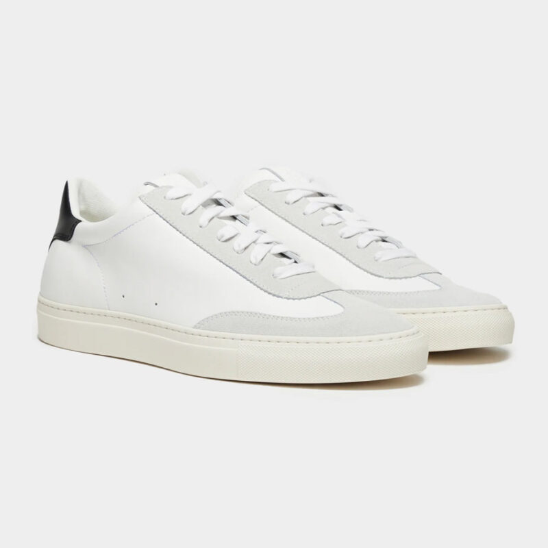 Todd Snyder's Tuscan Low Profile Sneaker in white with light grey suede shown at 3/4 angle. 
