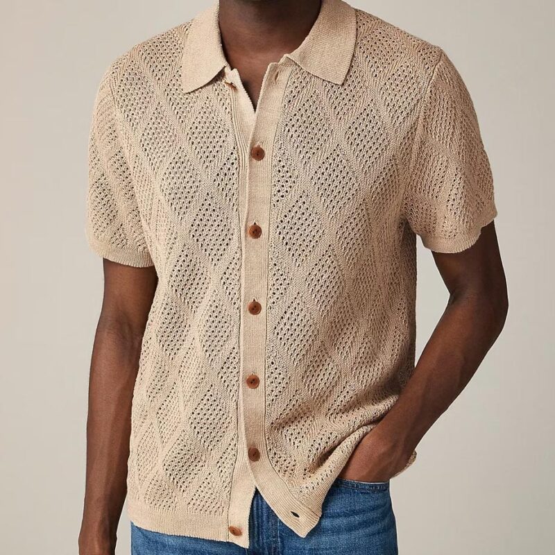 Male model wearing J.Crew's diamond-stitched linen sweater polo.